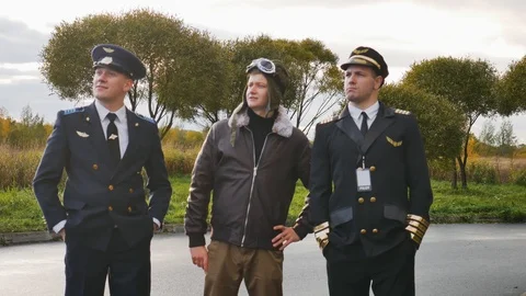Three funny pilots are dancing   joy  positive  aviator Stock Footage 117305054