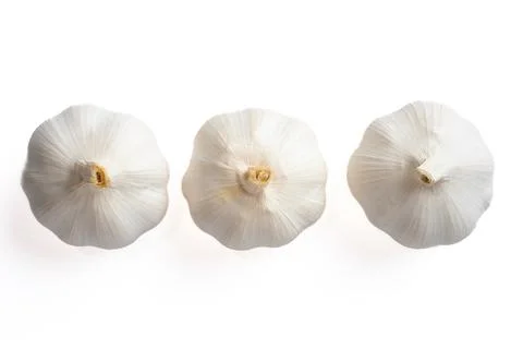 Three garlic bulbs on white background Stock Photos