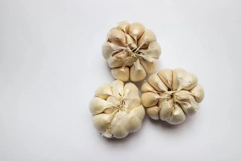 Three garlics on a white background Stock Photos