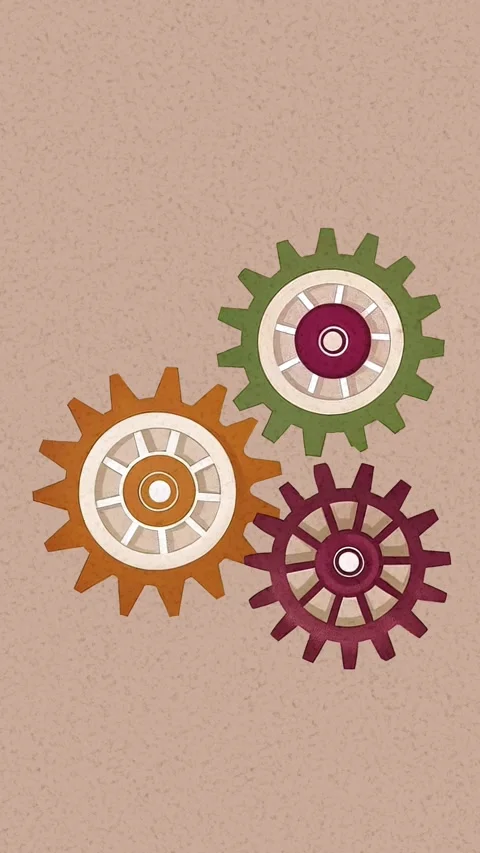 Three gears of different colors and sizes rotate on a grainy background Stock Footage 283657924