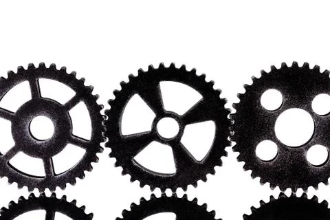 Three gears in front of white background Fotos Stock