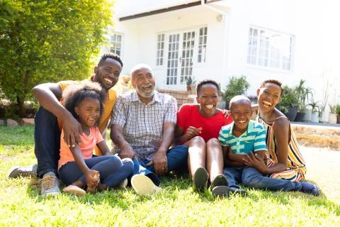Three generation African American family spending time together in their garden. Stock Photos