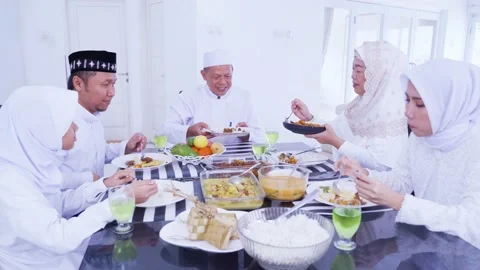 Three generation Muslim family eats together at Eid Stock Footage 152497321