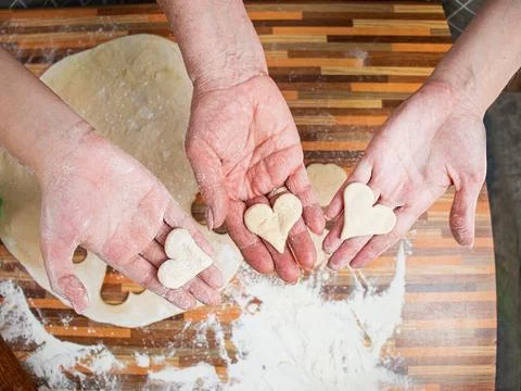 Three generations concept, heart-shaped cookies Stock Photos