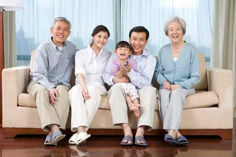 Three generations on couch Stock Photos