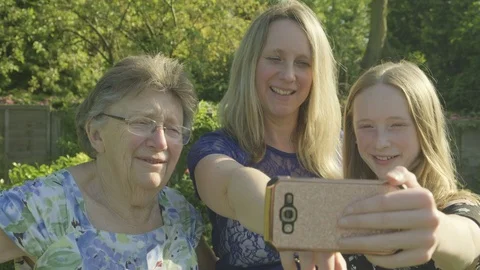 Three generations of the same family taking a selfie Video stock 89985534