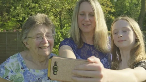 Three generations of the same family taking a selfie Video stock 89986078