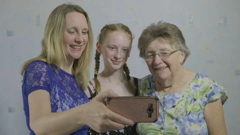 Three generations of the same family taking a selfie Video stock 90104331