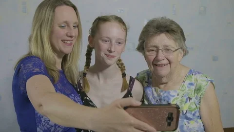 Three generations of the same family taking a selfie Video stock 90104852