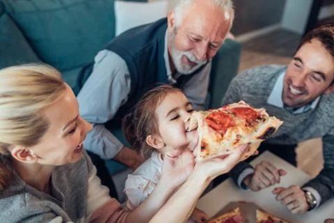 Three generations at a table Stock Photos