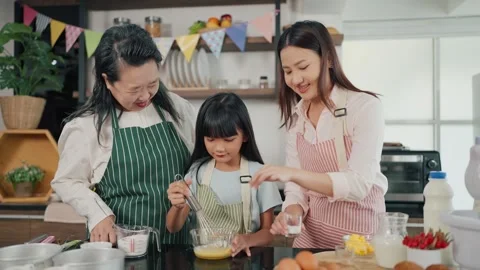Three generations women having baking, cooking together in kitchen room at home. Stock Footage 255633608