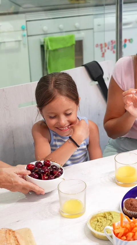 Three generations of women sharing healthy breakfast together Stock Footage 340321885