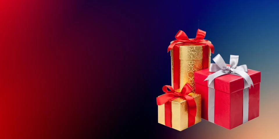Three gift boxes with red ribbons are arranged on the right. The largest box is  Stock Photos