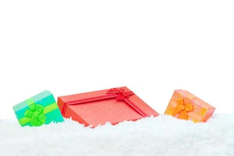 Three gift boxes in snow Stock Photos