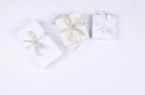 Three gift boxes on white background. Stock Photos