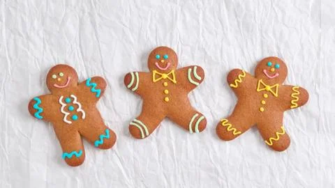 Three ginger men on a white background. Funny cute cookies in the shape of a Stock Photos