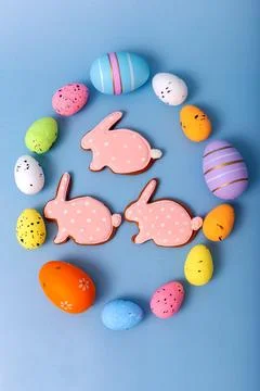 Three gingerbread in the form of a rabbit inside an oval frame of multicolored Stock Photos