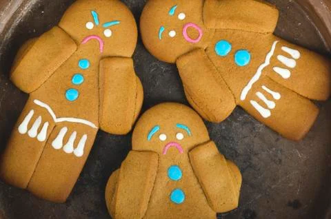 Three gingerbread man cookies Stock Photos