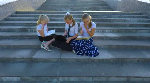 Three girl students doing lessons on the steps Video stock 51604673