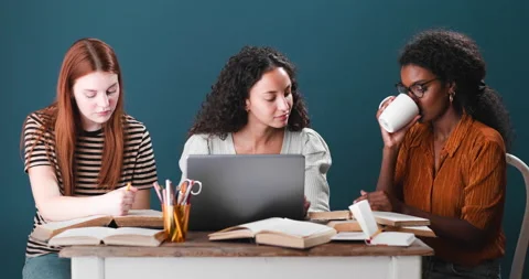 Three girls of different ethnicities studying together Stockbeeldmateriaal 134462557