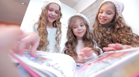 Three girls looking at book. Stock Footage 59139327