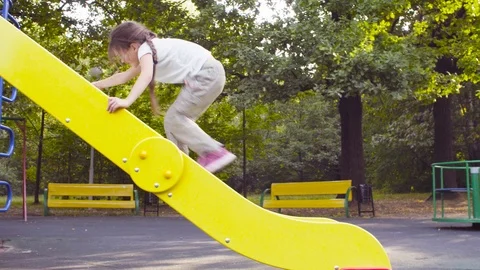 Three girls on a play complex on the playground Video stock 95472388