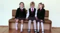 Three girls sitting on a bench in the school HD Footage