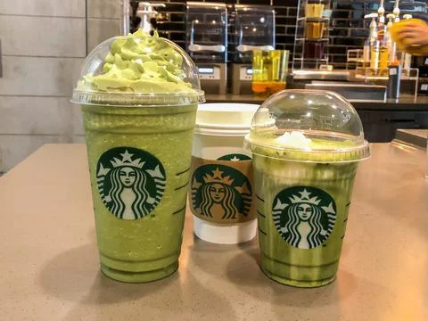 Three glass difference size of green tea in the Starbucks coffee shop Stock Photos