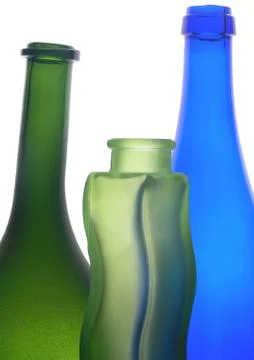 Three glass empty bottle on a white Stock Photos