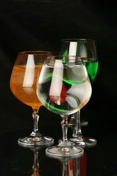 Three glasses on a black background Stock Photos