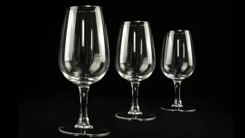 Three glasses black background slowly tunring 스톡 동영상 229739476