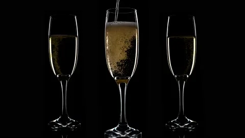 Three glasses of champagne on a black background. Stock Footage 145776310