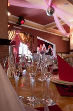 Three glasses in the foreground in a cafe Stock Photos