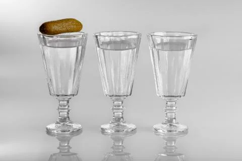 Three glasses of vodka with snack Stock Photos