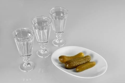 Three glasses of vodka with snack Stock Photos