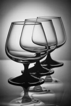 Three glasses in white light Стоковые фото