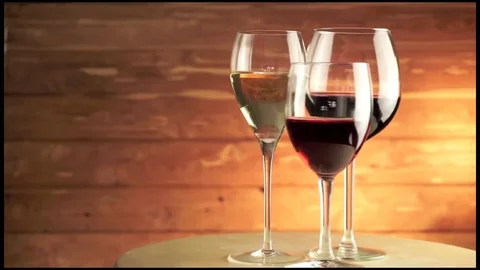 Three glasses of wine on the table Stock Footage 85182725