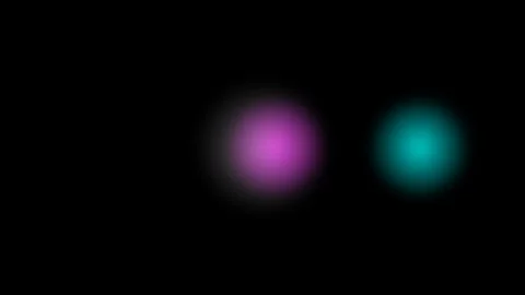Three glowing circular orbs in cyan grey and magenta against a black background Video stock 335117206