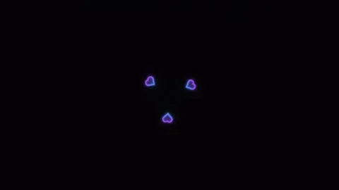 Three glowing hearts on a dark background show a simple Stock Footage 338237636