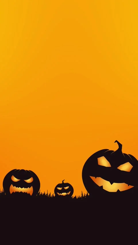 Three glowing jack-o-lanterns on grass against an orange Halloween background Stock Footage 346068150
