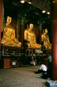 Three gold Buddhas Foto stock