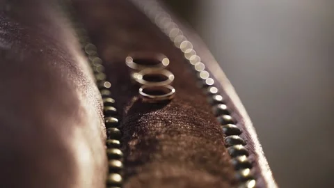 Three gold wedding rings Stock Footage 147753090