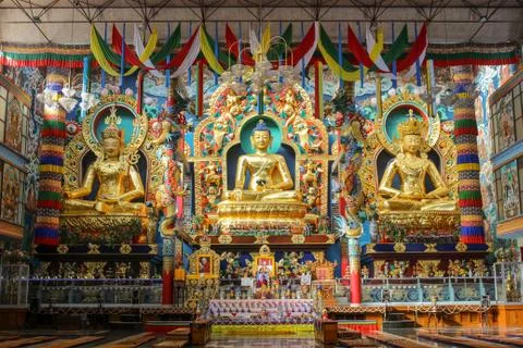 The three Golden Buddha Statues in Bylakuppe in Karnataka/India. Stock Photos