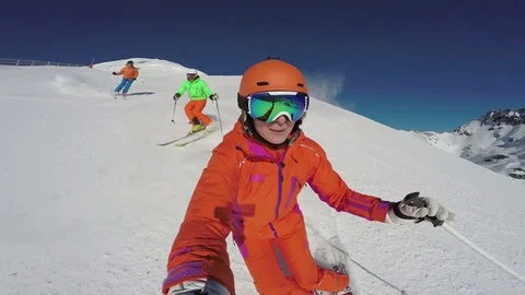 Three good skiers skiing on sunny winter day Stock Footage