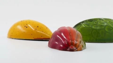 Three Gourmet Chocolates Rotating On A White Background, London, UK - 4K Stock Footage 132431388