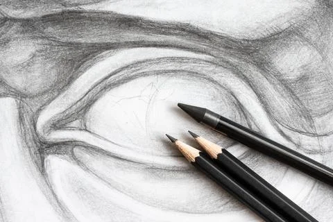 Three graphite pencils on drawing of David's eye Foto stock