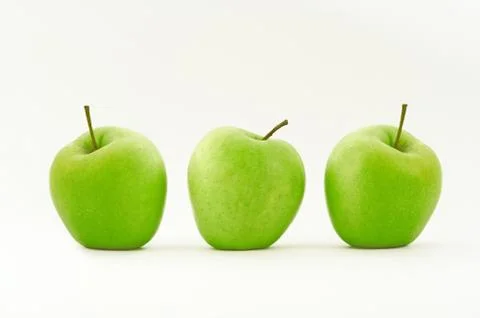 Three green apple in row Stock-Fotos