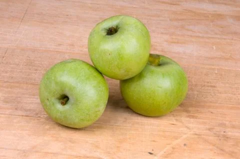 Three green apples Stock Photos