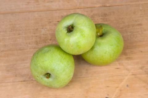 Three green apples Stock Photos