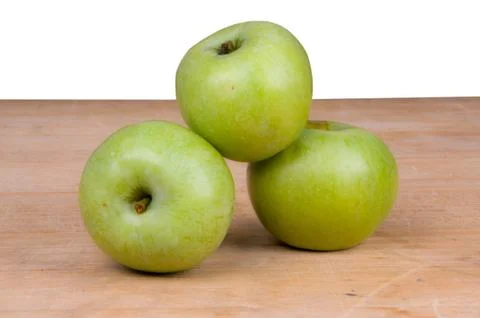 Three green apples Stock Photos